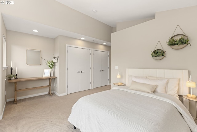 5026 SE Mill St, Portland, OR 97215 - bedroom featuring multiple closets, light colored carpet, baseboards, and recessed lighting