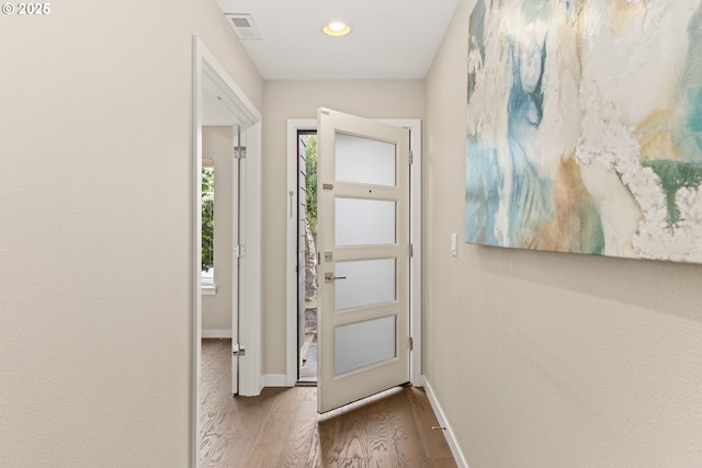 5026 SE Mill St, Portland, OR 97215 - entryway featuring wood finished floors, baseboards, and recessed lighting