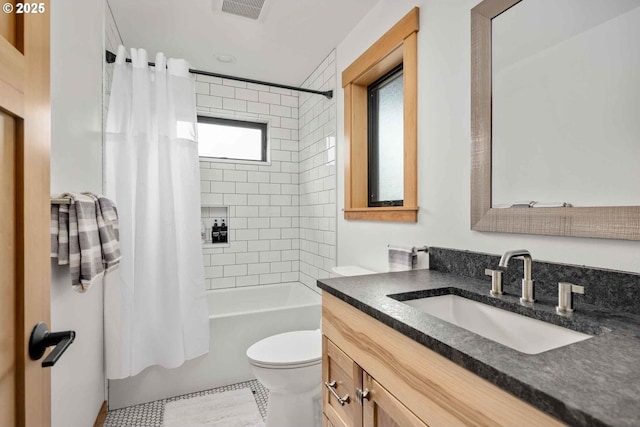 full bath featuring toilet, shower / tub combo, and vanity