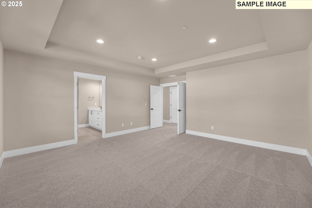 17301 SW Atfalati Ln Unit 38, Sherwood, OR 97140 - unfurnished bedroom featuring a raised ceiling, recessed lighting, light colored carpet, and ensuite bathroom
