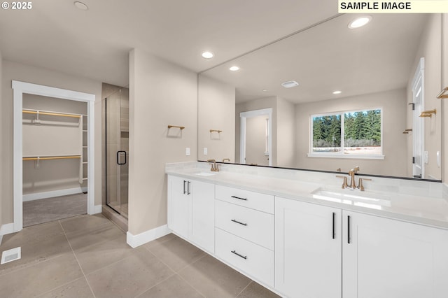 17301 SW Atfalati Ln Unit 38, Sherwood, OR 97140 - full bathroom featuring recessed lighting, double vanity, a stall shower, tile patterned flooring, and a spacious closet