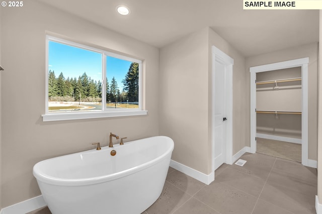 17301 SW Atfalati Ln Unit 38, Sherwood, OR 97140 - bathroom with a soaking tub, a walk in closet, and recessed lighting