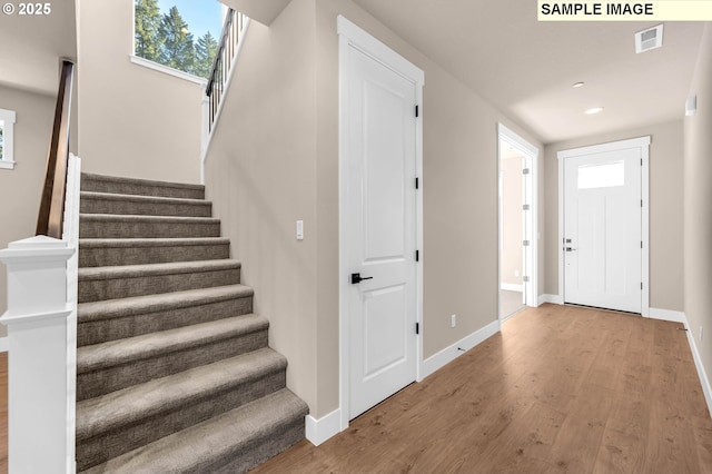 17301 SW Atfalati Ln Unit 38, Sherwood, OR 97140 - entrance foyer with wood finished floors, stairs, and recessed lighting