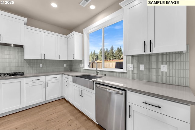 17301 SW Atfalati Ln Unit 38, Sherwood, OR 97140 - kitchen featuring appliances with stainless steel finishes, white cabinets, recessed lighting, and backsplash