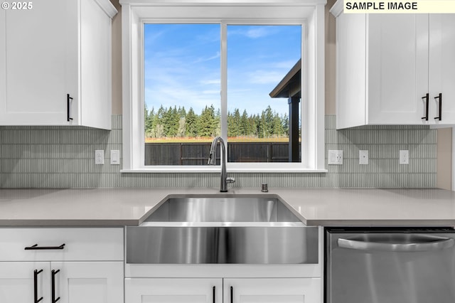17301 SW Atfalati Ln Unit 38, Sherwood, OR 97140 - kitchen with stainless steel dishwasher, light countertops, white cabinets, and decorative backsplash