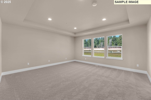17301 SW Atfalati Ln Unit 38, Sherwood, OR 97140 - spare room with a raised ceiling, recessed lighting, a smoke detector, and carpet flooring