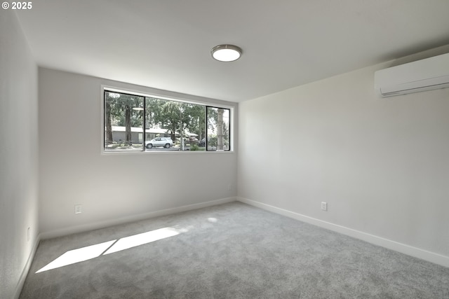 8885 SW White Pine Ln, Portland, OR 97225 - carpeted empty room with a wall mounted air conditioner and baseboards