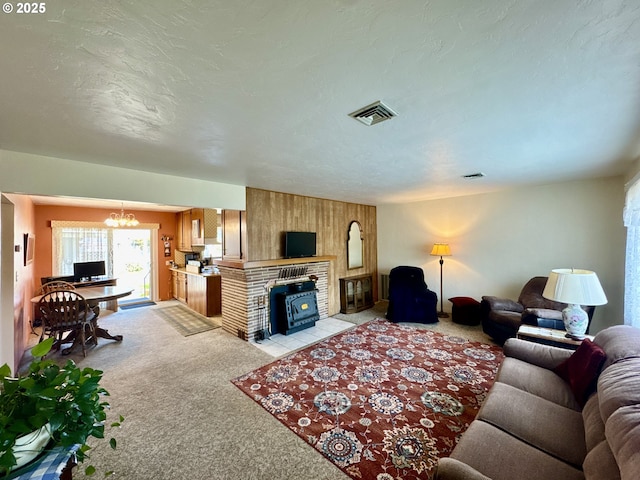 330 Maple St, Brookings, OR 97415 - living area featuring light colored carpet, a chandelier, wooden walls, and a fireplace with flush hearth