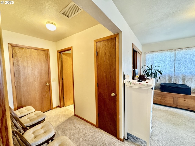 330 Maple St, Brookings, OR 97415 - corridor with carpet and a textured ceiling