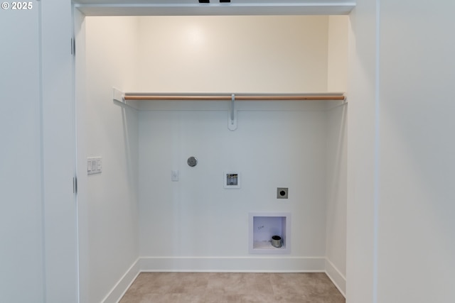 clothes washing area featuring hookup for a gas dryer, hookup for a washing machine, and electric dryer hookup