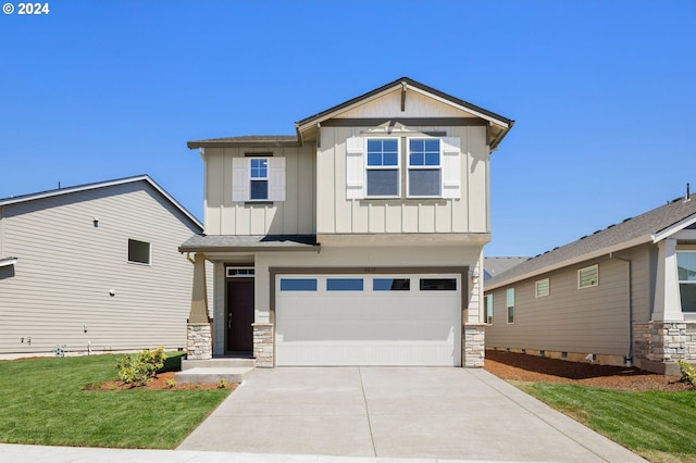 view of front of house featuring driveway, a garage, stone siding, board and batten siding, and a front yard