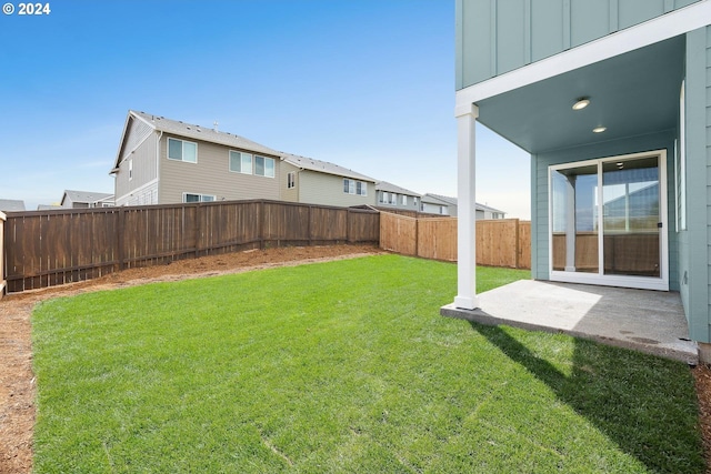 view of yard featuring a patio area and a fenced backyard