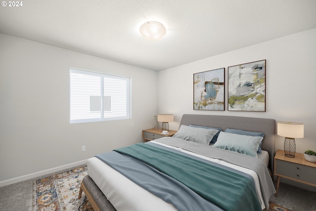 carpeted bedroom with baseboards