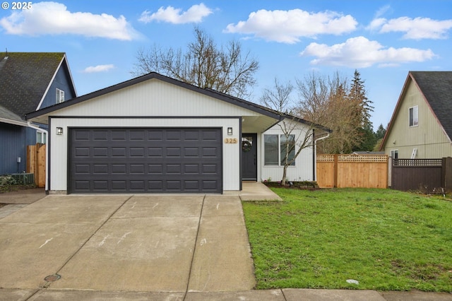 view of front facade featuring a garage, concrete driveway, a front lawn, and fence