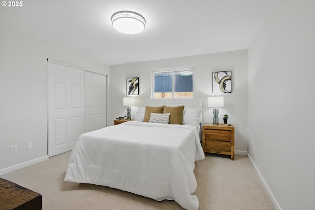 bedroom featuring a closet, baseboards, and carpet floors