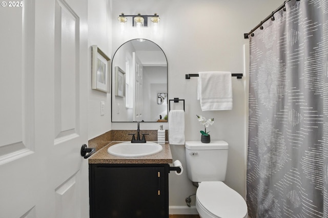 full bathroom featuring toilet and vanity