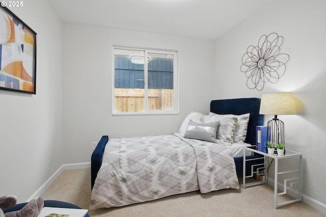 carpeted bedroom featuring baseboards