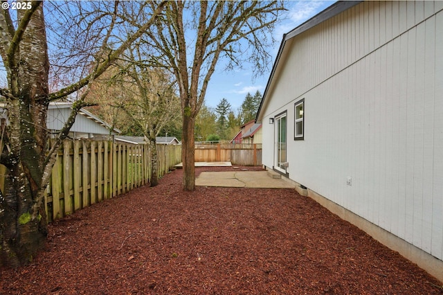 view of yard with a patio and a fenced backyard