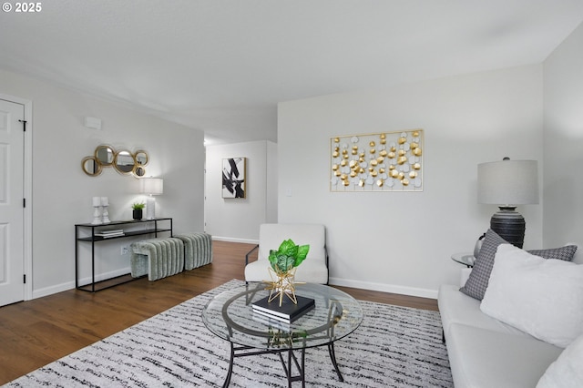 living room featuring baseboards and wood finished floors