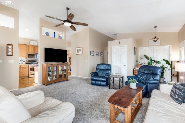 living room featuring light carpet, ceiling fan, and high vaulted ceiling