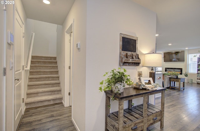 hall with hardwood / wood-style flooring