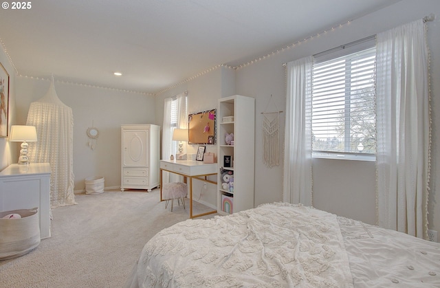 carpeted bedroom featuring multiple windows