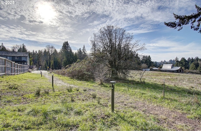 view of yard with a rural view