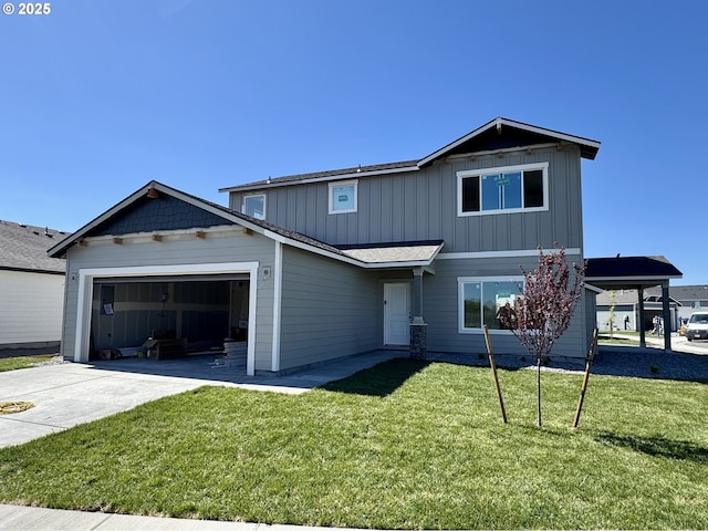 traditional home featuring board and batten siding, an attached garage, a front yard, and driveway