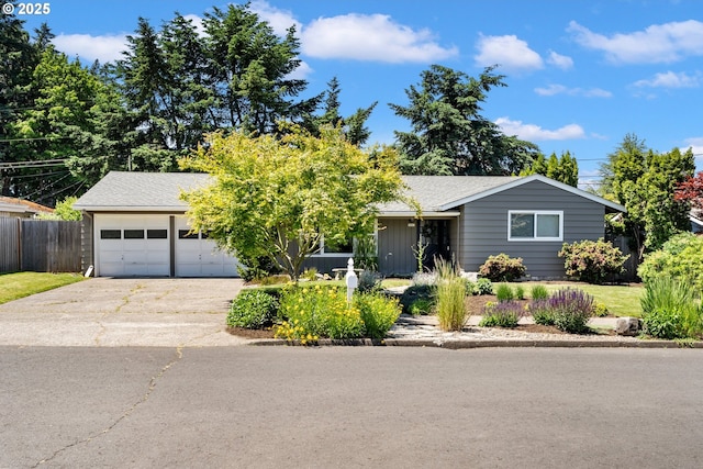 9885 SW Bonnie Brae Dr, Beaverton, OR 97008 - view of front facade with concrete driveway, an attached garage, and a shingled roof