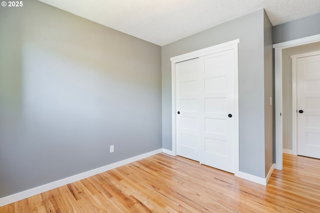 9885 SW Bonnie Brae Dr, Beaverton, OR 97008 - unfurnished bedroom featuring light wood-type flooring, baseboards, and a closet