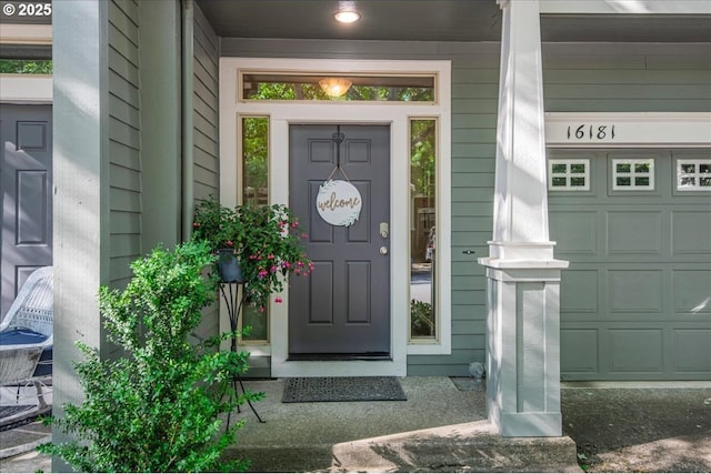 16181 SW Holland Ln, Sherwood, OR 97140 - property entrance featuring covered porch and a garage