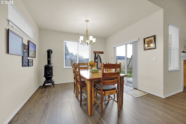 760 S 52nd St, Springfield, OR 97478 - dining room with dark wood-style floors, a chandelier, and baseboards