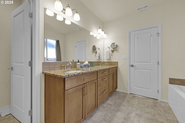 760 S 52nd St, Springfield, OR 97478 - full bath with double vanity, a bath, and baseboards
