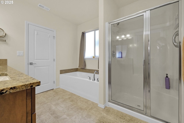 760 S 52nd St, Springfield, OR 97478 - bathroom featuring a shower stall, a garden tub, vanity, and baseboards