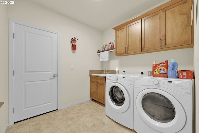 760 S 52nd St, Springfield, OR 97478 - laundry room featuring washing machine and clothes dryer, cabinet space, and baseboards