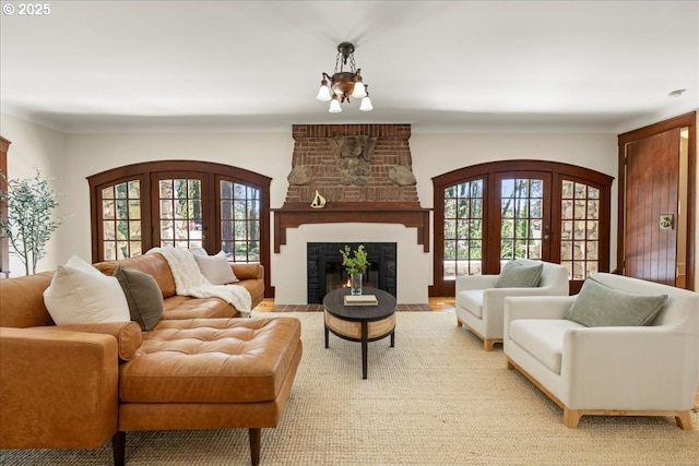 49 Briarwood Rd, Lake Oswego, OR 97034 - living room with french doors, a fireplace, and a chandelier