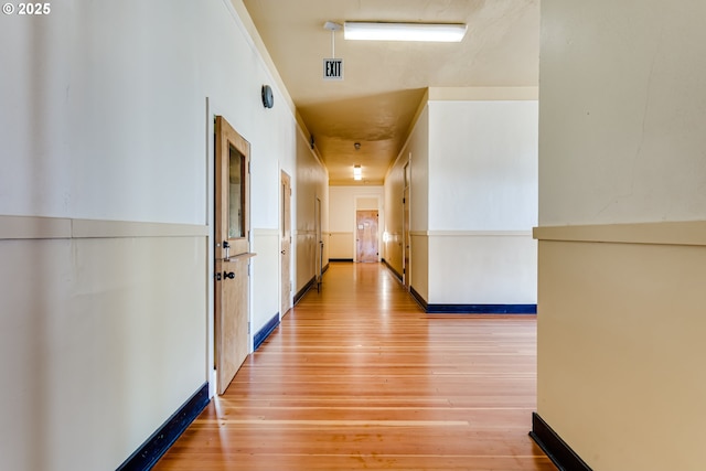 hall with hardwood / wood-style floors