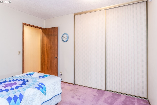 12618 NE Prescott Dr, Portland, OR 97230 - carpeted bedroom featuring a closet and a textured ceiling