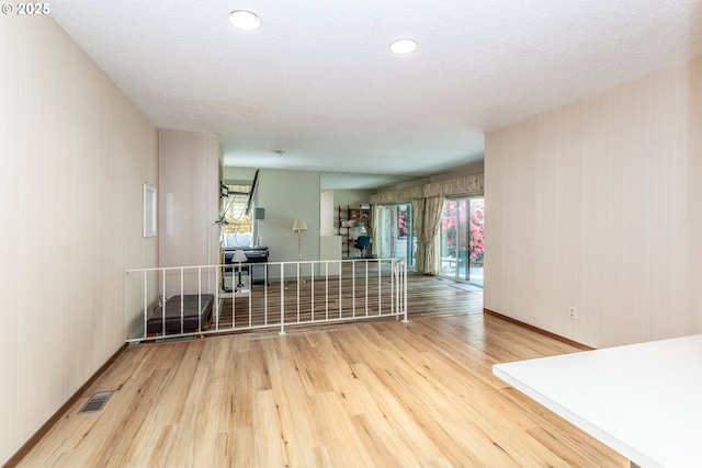 12618 NE Prescott Dr, Portland, OR 97230 - unfurnished room featuring baseboards, visible vents, and wood finished floors