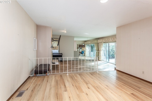 12618 NE Prescott Dr, Portland, OR 97230 - empty room featuring baseboards, wood finished floors, and visible vents