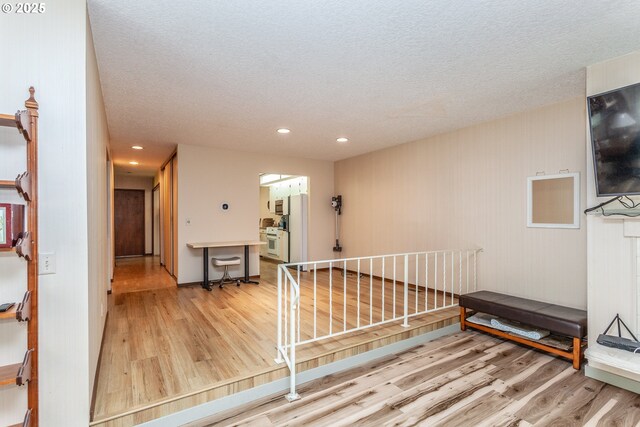 12618 NE Prescott Dr, Portland, OR 97230 - interior space with light wood-type flooring, recessed lighting, and a textured ceiling