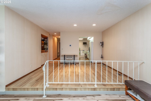 12618 NE Prescott Dr, Portland, OR 97230 - interior space featuring baseboards, recessed lighting, a textured ceiling, and wood finished floors