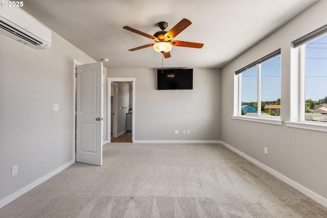 1502 Timothy St, Philomath, OR 97370 - spare room featuring a wall mounted air conditioner, ceiling fan, carpet flooring, and baseboards