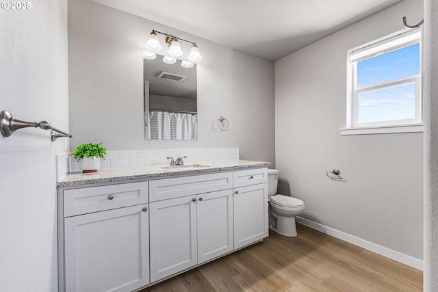 1502 Timothy St, Philomath, OR 97370 - bathroom featuring toilet, baseboards, vanity, and wood finished floors