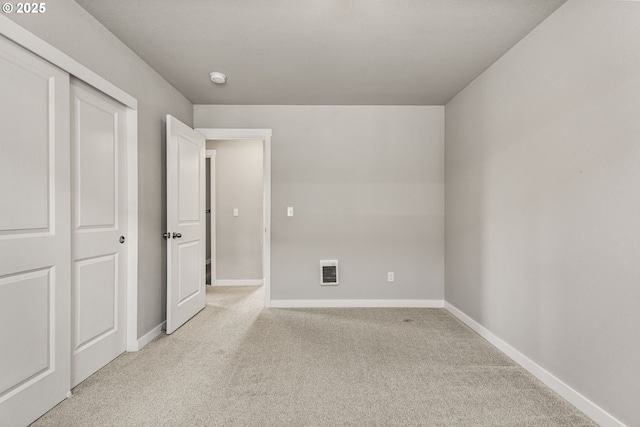 1502 Timothy St, Philomath, OR 97370 - unfurnished bedroom featuring light carpet, baseboards, and heating unit