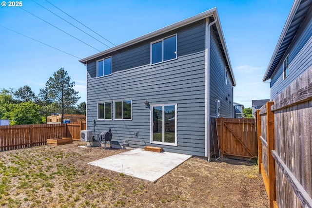 1502 Timothy St, Philomath, OR 97370 - back of house featuring a patio, a gate, a fenced backyard, and ac unit