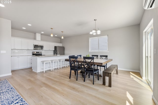 1502 Timothy St, Philomath, OR 97370 - dining area with recessed lighting, light wood-type flooring, a chandelier, baseboards, and a wall unit AC