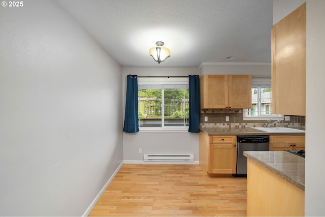 3925 SW Multnomah Blvd Unit 204, Portland, OR 97219 - kitchen with dishwasher, baseboard heating, decorative backsplash, light wood-type flooring, and a sink
