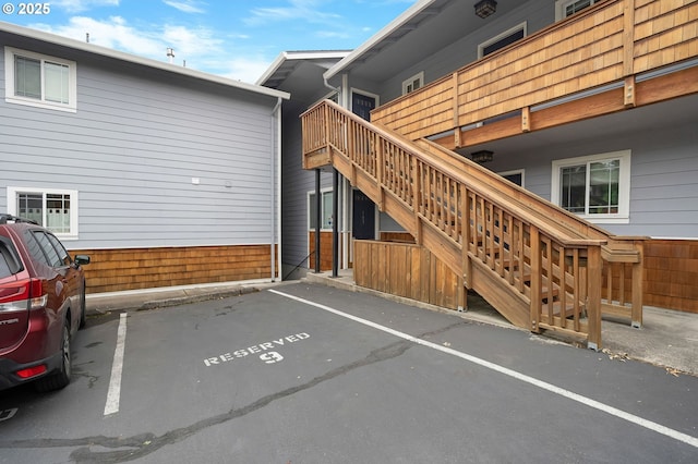 3925 SW Multnomah Blvd Unit 204, Portland, OR 97219 - back of house with stairway and uncovered parking