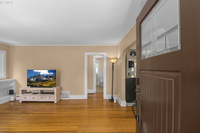3305 NE Siskiyou St, Portland, OR 97212 - entryway with baseboards, wood finished floors, ornamental molding, and arched walkways